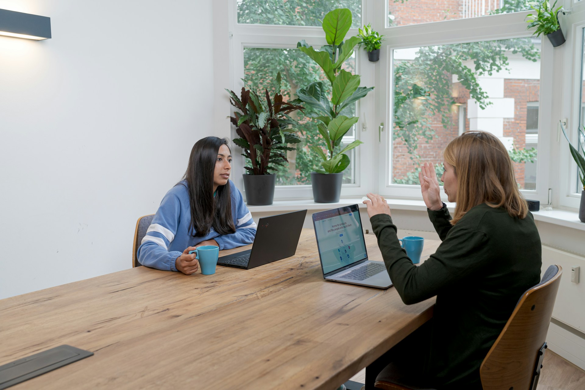 Two women engaging in an office. Business grants for women.