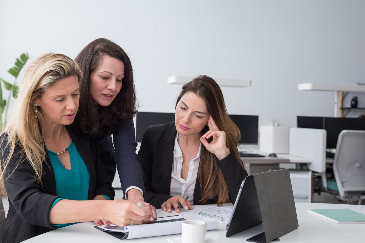 A group of businesswomen preparing a schedule. small business grants in Seattle