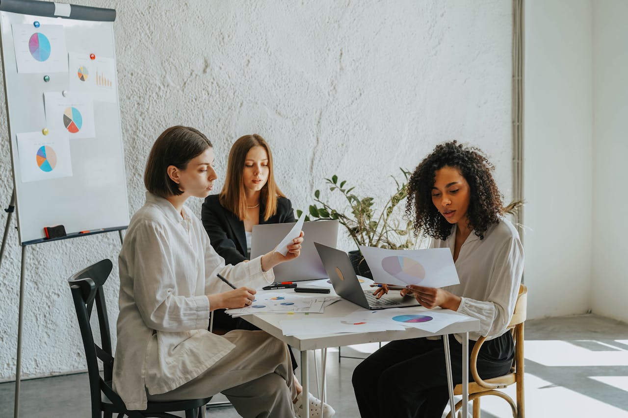 Three women working together. Business grants for women in Georgia.