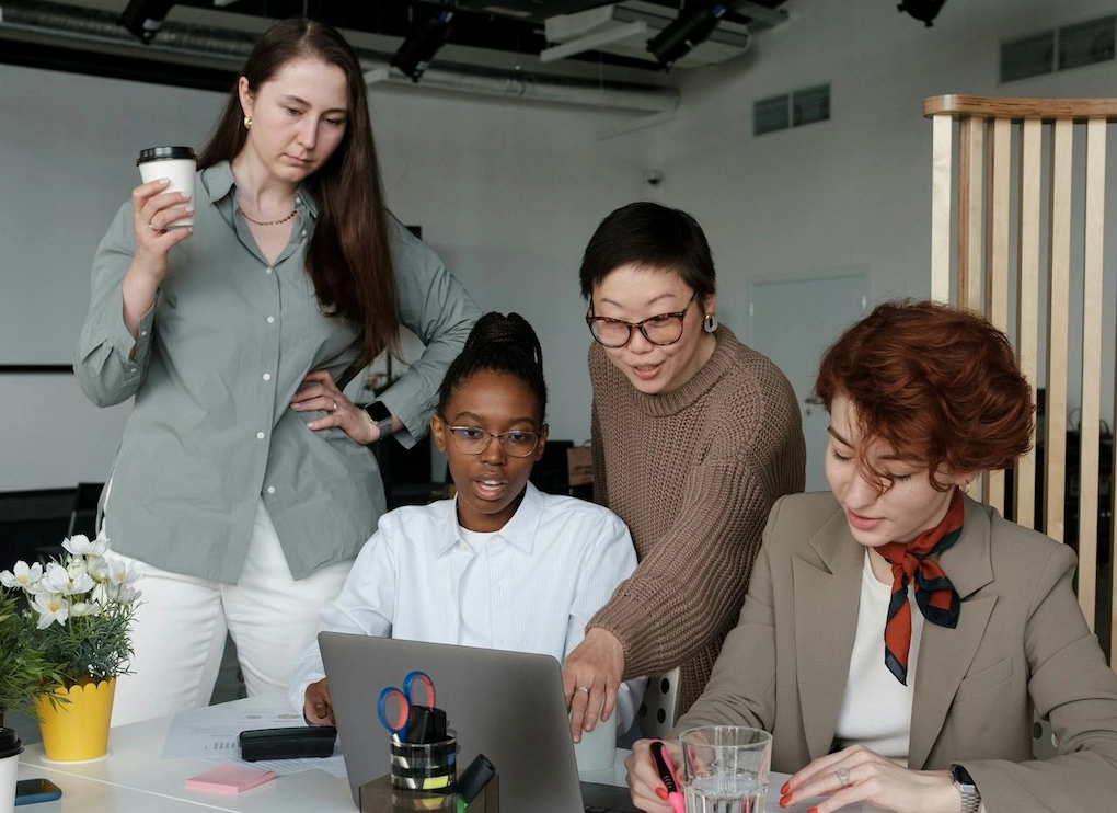 4 women working together in a modern office setting. How to Turn Your Business Story into a Fundable Narrative