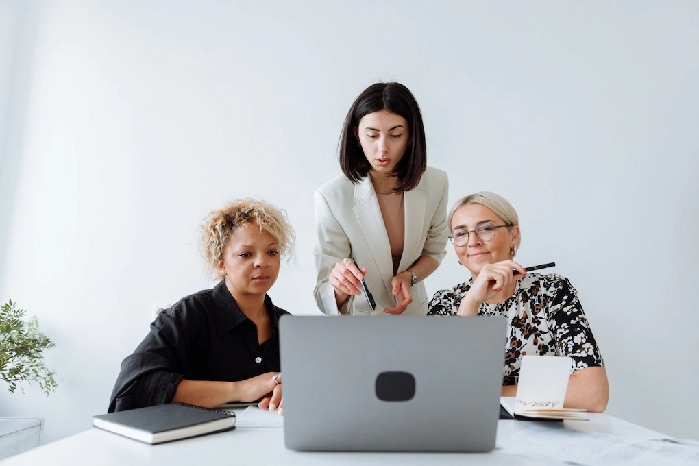 Three women collaborating on a project. Can You Change How You Use Grant Money After Receiving It?