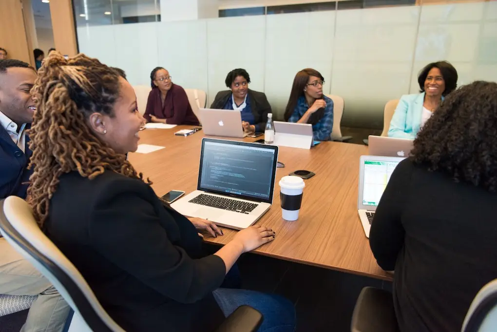 A group of people working together in an office. How to talk about failure in business grant applications.