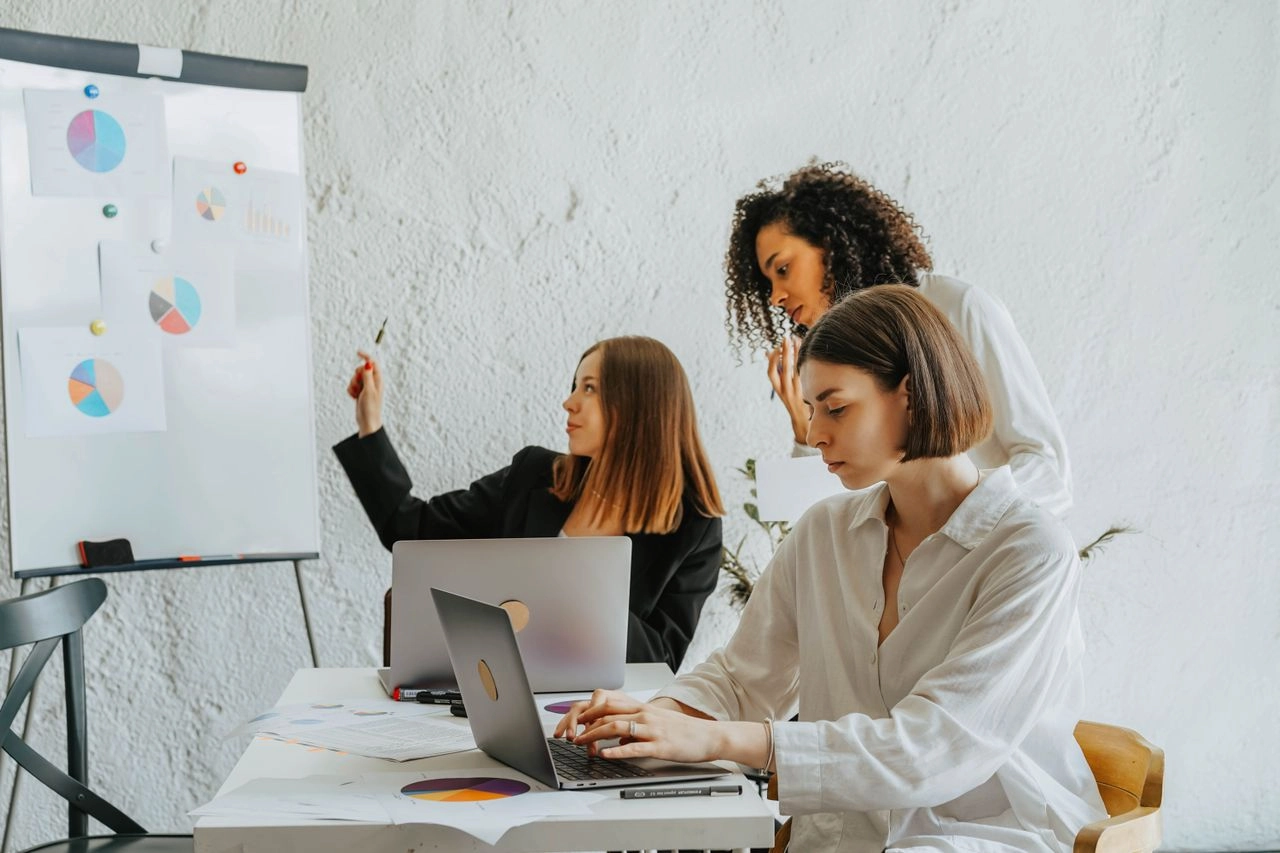 Women working together in the office. Track Your Business Grant Spending Without Hiring an Accountant