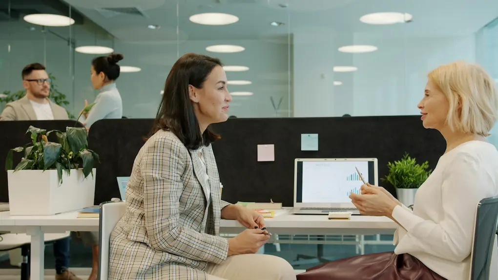 Two women discussing work. what happens after you win a business grant
