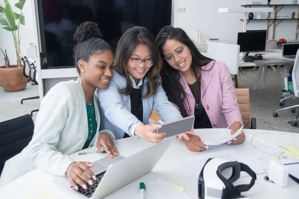 Three women working together. Business Grants for Women in Chicago